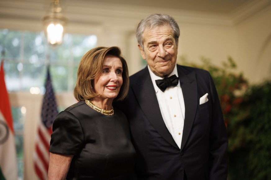 epa10707364 Representative Nancy Pelosi (L), a Democrat from California, and Paul Pelosi (R), arrive to attend a state dinner in honor of Indian Prime Minister Narendra Modi hosted by US President Joe ...