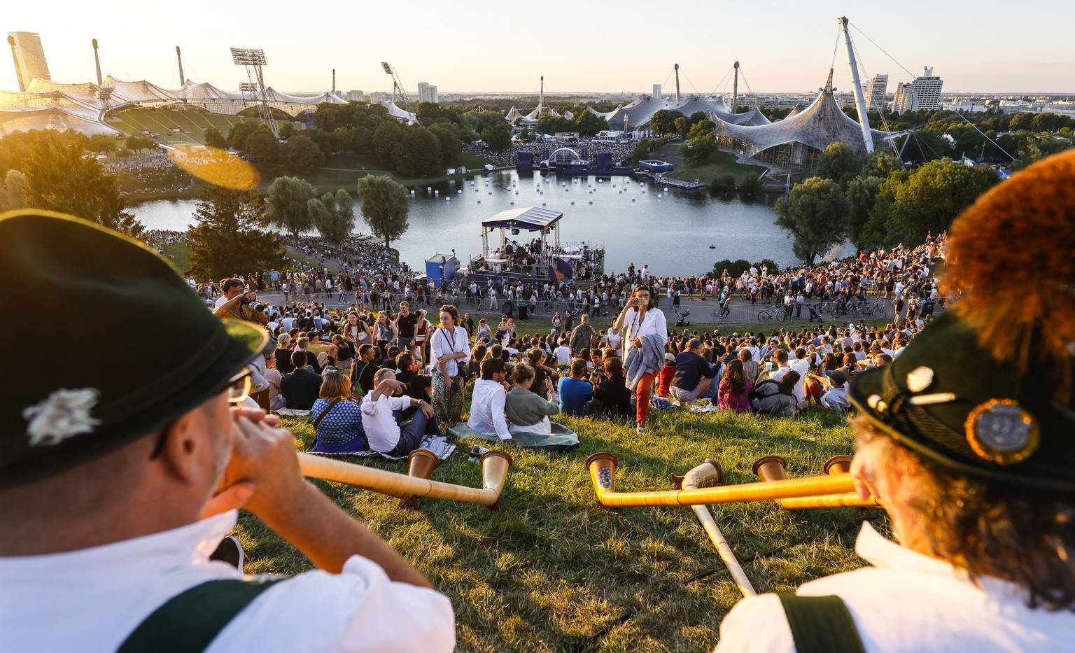 epa10114678 People attend the opening ceremony for the European Championships Munich 2022, Munich, Germany, 10 August 2022. The championships will feature nine Olympic sports, Athletics, Beach Volleyb ...