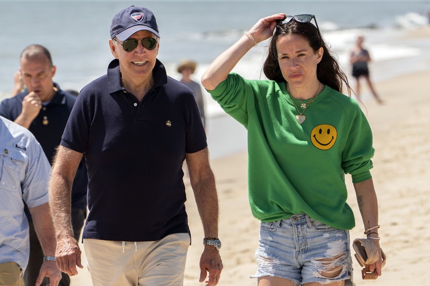 FILE �?? President Joe Biden walks on the beach with daughter Ashley Biden, in Rehoboth Beach, Del., June 20, 2022. Two people have pleaded guilty in a scheme to peddle a diary and other items belongi ...
