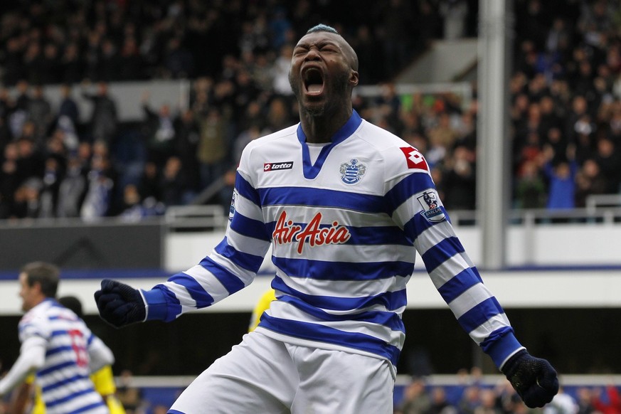 Queens Park Rangers&#039; Djibril Cisse celebrates his goal against Reading during their English Premier League soccer match at Loftus Road stadium, London, Sunday, Nov. 4, 2012. (AP Photo/Sang Tan)