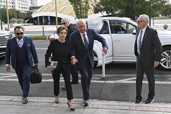Rupert Murdoch, center, and his wife Elena Zhukova Murdoch arrive at the Second Judicial District Court in Reno, Nev., Monday Sept. 16, 2024. (AP Photo/Andy Barron).Rupert Murdoch,Elena Zhukova Murdoc ...