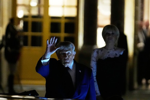 epa13045483 US President Donald Trump (C) departs after a dinner at the Palace of Versailles, Versailles, France, 18 June 2026, as French First Lady Brigitte Macron (R) stands behind. EPA/Michel Euler ...