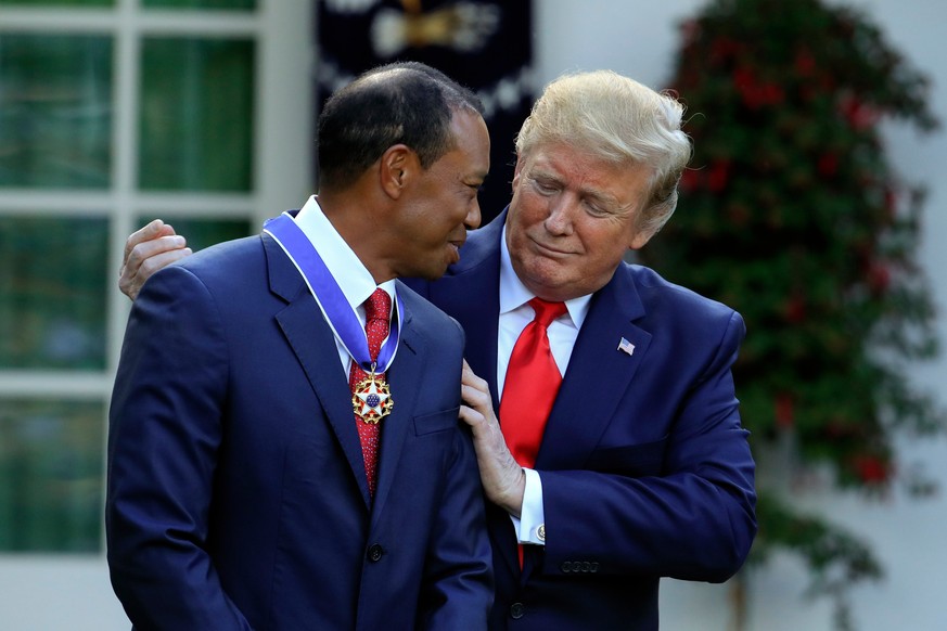 FILE - President Donald Trump presents the Presidential Medal of Freedom to Tiger Woods during a ceremony in the Rose Garden of the White House in Washington, Monday, May 6, 2019. (AP Photo/Manuel Bal ...