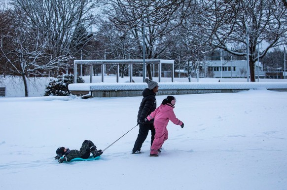 Children are playing with snow during a snowfall in Linkoping, Sweden, on December 24, 2023. (Photo by Pradeep Dambarage/NurPhoto via Getty Images)