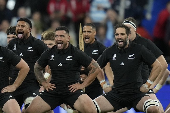 New Zealand&#039;s Aaron Smith, center, performs the Haka with teammates before the Rugby World Cup semifinal match between Argentina and New Zealand at the Stade de France in Saint-Denis, outside Par ...