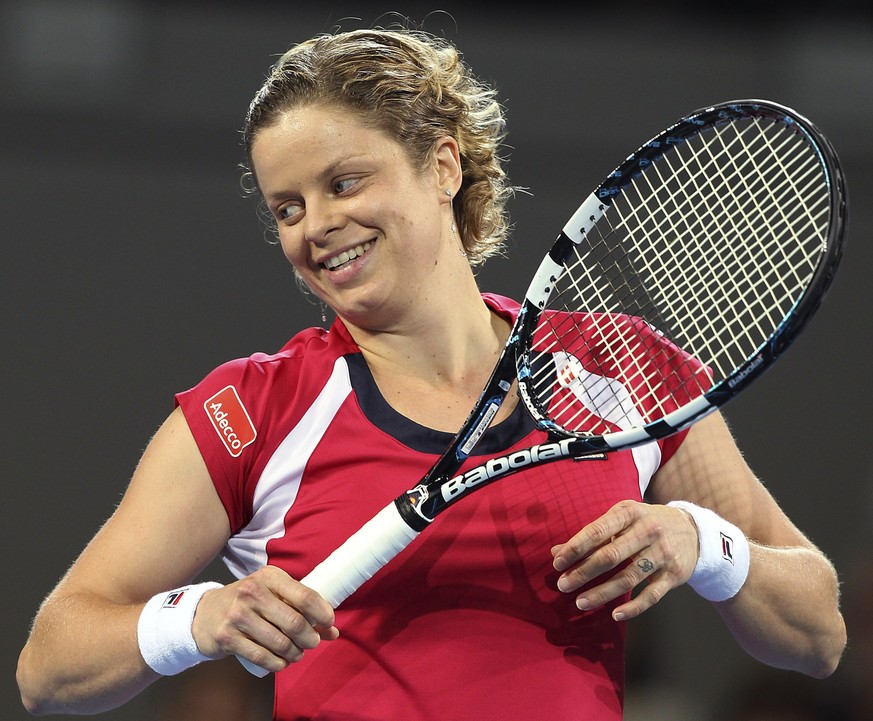 Kim Clijsters of Belgium reacts after playing a shot in her quarterfinal match against Iveta Benesova of the Czech Republic during the Brisbane International tennis tournament in Brisbane, Australia,  ...
