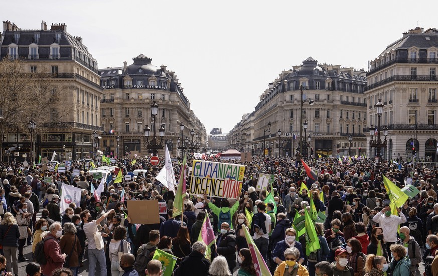 epa09103059 Thousands of Climate activists take part in a demonstration asking for a ?real Climate law? in Paris, France, 28 March 2021. French parliament will start to look at a text on 29 March 2021 ...