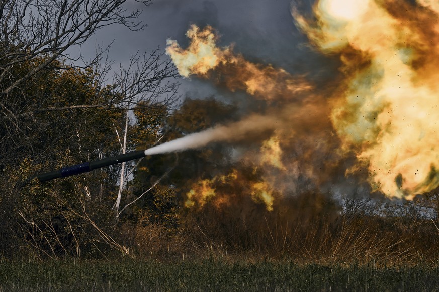 A Ukrainian tank fires near Bakhmut, Donetsk region, Ukraine, Saturday, Oct. 22, 2022. (AP Photo/LIBKOS)
