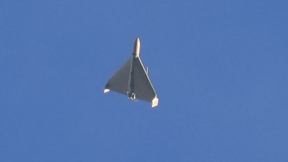 FILE - A drone is seen in the sky seconds before it attacked buildings in Kyiv, Ukraine, on Oct. 17, 2022. The Russian military has been using the Iranian Shahed exploding drones to strike Ukraine&#03 ...