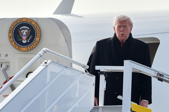 President Donald Trump steps off Air Force One after arriving at Zurich International Airport for the World Economic Forum, Wednesday, Jan. 21, 2026, in Zurich, Switzerland. (AP Photo/Evan Vucci)