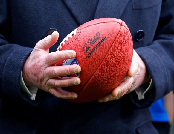 LONDON, UNITED KINGDOM - FEBRUARY 12: (EMBARGOED FOR PUBLICATION IN UK NEWSPAPERS UNTIL 24 HOURS AFTER CREATE DATE AND TIME) King Charles III is presented with an American football from Super Bowl LIX ...