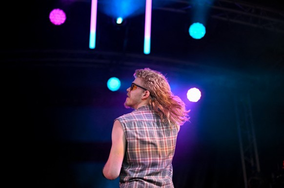 A person contests during the annual European Mullet Cup in Audregnies, southern Belgium, on May 23, 2026. This year's European championship is the fourth to be held since a group of enthusiasts i ...