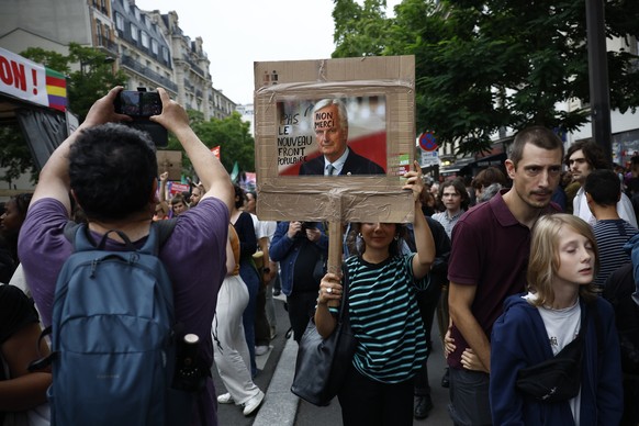epa11591391 People attend a protest rally in Paris, France, 07 September 2024 as the French left parties called for rallies against President Macron&#039;s politics. Protests are taking place across F ...