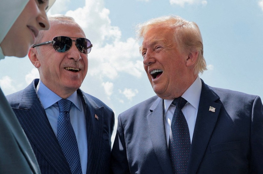 U.S. President Donald Trump is greeted by Turkish President Tayyip Erdogan as he arrives aboard Air Force One at Etimesgut Air Base, for a NATO summit, in Ankara, Turkey, July 7, 2026. REUTERS/Jonatha ...