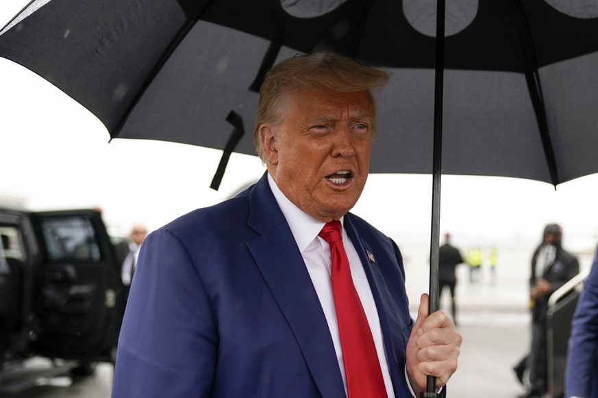 Former President Donald Trump speaks before he boards his plane at Ronald Reagan Washington National Airport, Aug. 3, 2023, in Arlington, Va. This week&#039;s charges against Trump for trying to remai ...