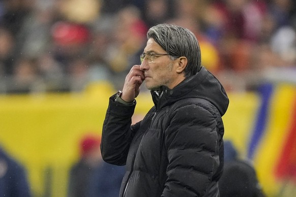 Switzerland&#039;s coach Murat Yakin touches his face during the Euro 2024, group I, qualifying soccer match between Romania and Switzerland at the National Arena stadium in Bucharest, Romania, Tuesda ...