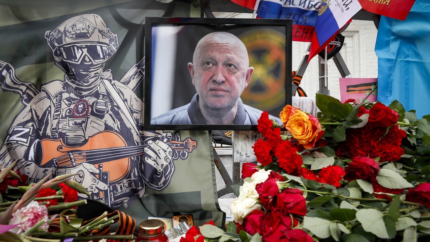 epa10821331 A portrait of PMC Wagner chief Yevgeny Prigozhin at an informal memorial to him in Moscow, Russia, 26 August 2023. An investigation was launched into the crash of an aircraft in the Tver r ...