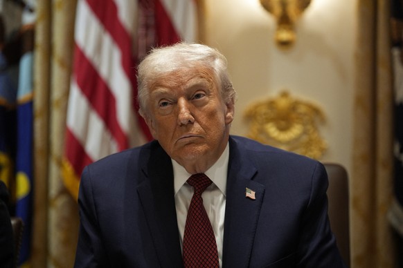 epa12579373 US President Donald Trump during a roundtable in the Cabinet Room at the White House in Washington, DC, USA, 08 December 2025, where he is reportedly expected to announce 12 billion aid pl ...