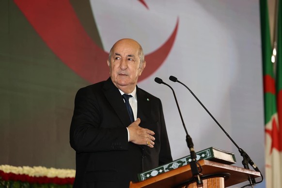 epa11609806 A handout picture provided by the Algerian Presidency Press Service shows Algerian President Abdelmadjid Tebboune takes the oath of office during the swearing-in ceremony in Algiers, Alger ...