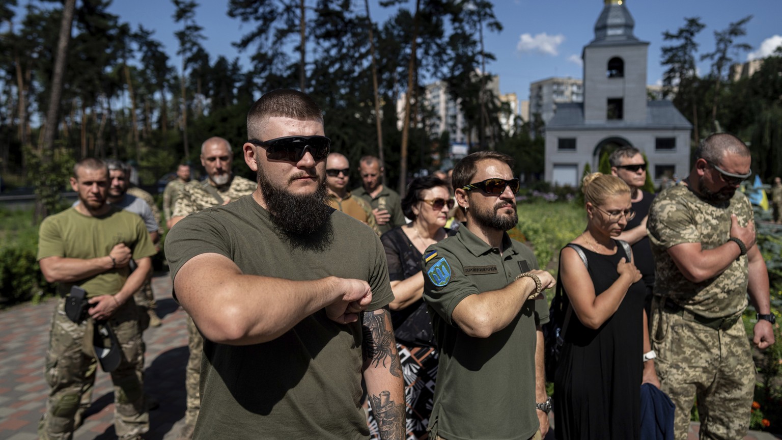 Ukrainian servicemen attend a farewell ceremony of their fallen comrade Nicholas Maimer, a U.S. citizen and Army veteran who was killed during fighting in Bakhmut against Russian forces, in Ukrajinka, ...