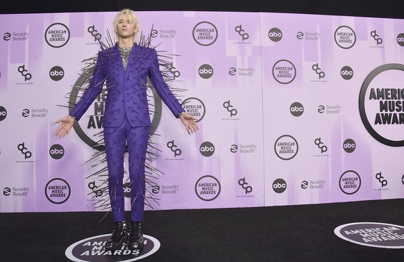 Machine Gun Kelly arrives at the American Music Awards on Sunday, Nov. 20, 2022, at the Microsoft Theater in Los Angeles. (Photo by Jordan Strauss/Invision/AP)