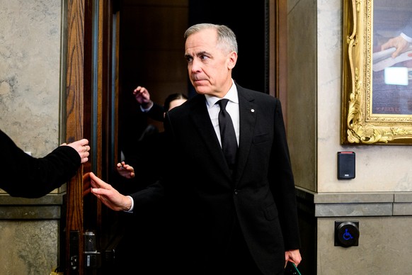 Prime Minister Mark Carney leaves the House of Commons on Parliament Hill in Ottawa, on Wednesday, Feb. 11, 2026. (Spencer Colby/The Canadian Press via AP)
Canada Carney