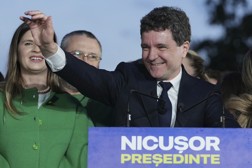 Presidential candidate Nicusor Dan speaks to media after polls closed for the second round of the country&#039;s presidential election redo in Bucharest, Romania, Sunday, May 18, 2025. (AP Photo/Andre ...