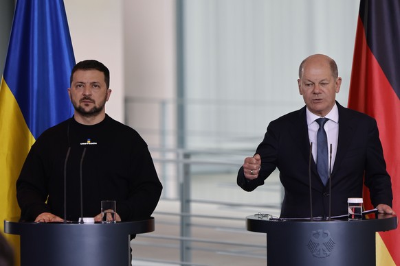 epa10626984 Ukrainian President Volodymyr Zelensky (L) and German Chancellor Olaf Scholz (R) address a joint press conference following their meeting at the Chancellery in Berlin, Germany, 14 May 2023 ...
