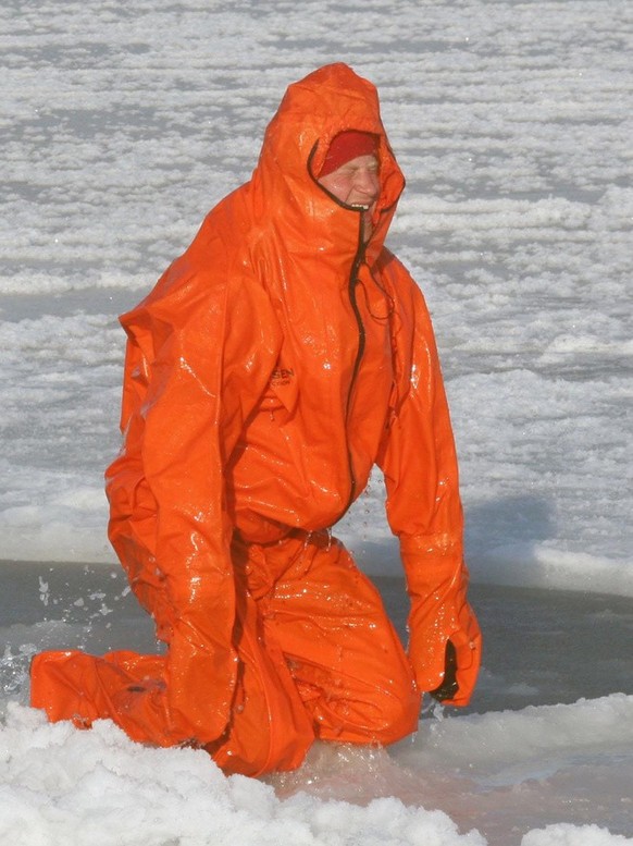 Britain&#039;s Prince Harry reacts as he tries out an immersion suit, during training for the Walking with the Wounded expedition, on the island of Spitsbergen, situated between the Norwegian mainland ...