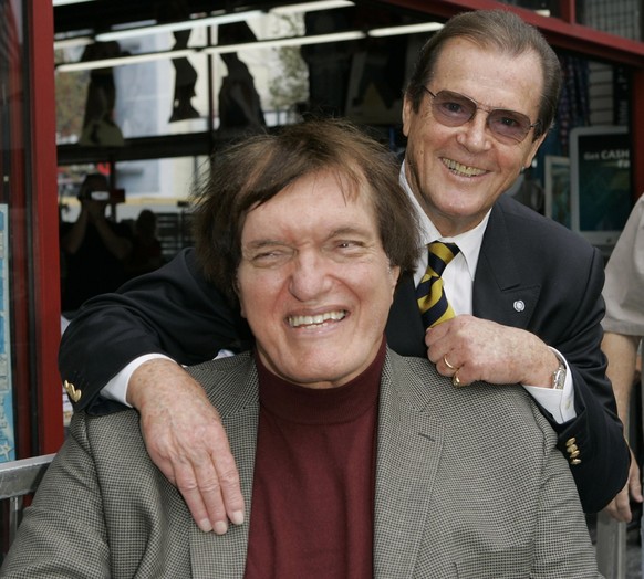 FILE - In this Oct. 11, 2007 file photo, actor Roger Moore, right, who played the part of James Bond 007 in seven films, poses with actor Richard Kiel who played the role of Jaws in &quot;The Spy Who  ...
