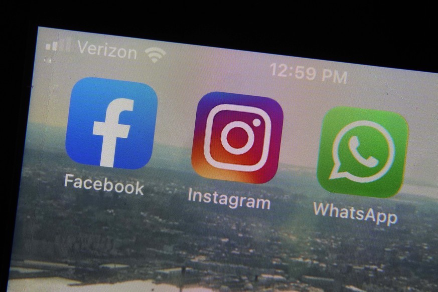 FILE - The mobile phone apps for, from left, Facebook, Instagram and WhatsApp are shown on a device in New York. The company that owns Facebook and Instagram said Monday, May 23, 2022, it will begin r ...