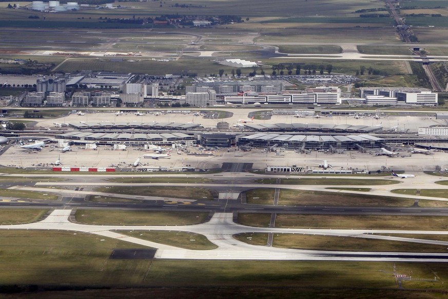 FILE - This June 23, 2011 aerial file photo shows Roissy Charles De Gaulle hub 2, north of Paris. French opposition lawmakers from the right and the left are joining efforts to try to block the govern ...