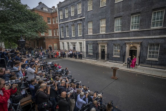 Outgoing British Prime Minister Boris Johnson arrives with his wife Carrie to speak outside Downing Street in London, Tuesday, Sept. 6, 2022 before heading to Balmoral in Scotland, where he will annou ...