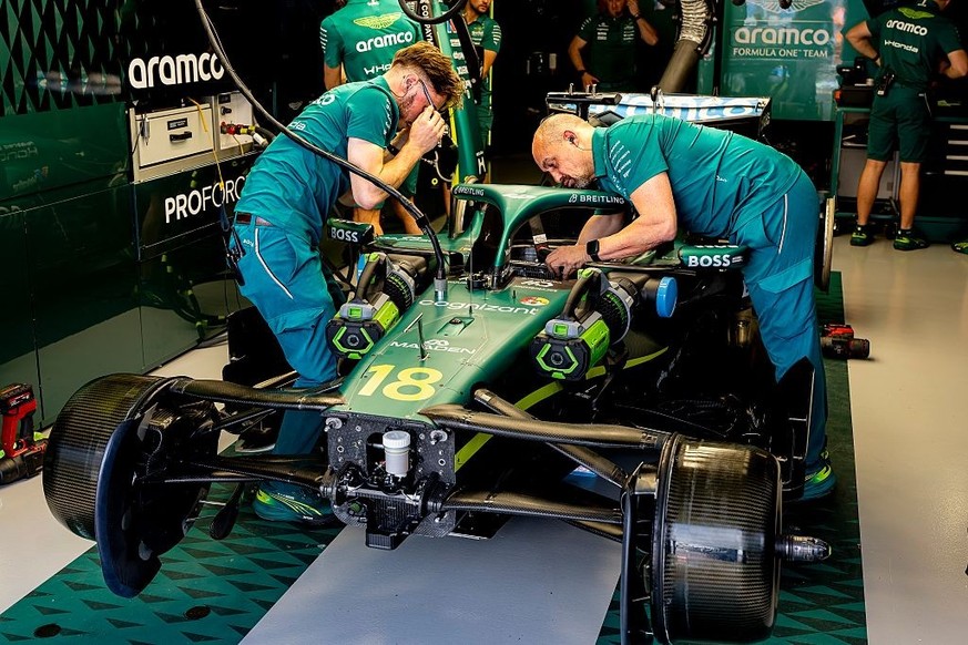 Mechanics work on the car of Formula 1 driver Lance Stroll of the Aston Martin Aramco Formula 1 Team during the Formula 1 Melbourne free practice session at Albert Park in Melbourne, Australia, on Mar ...