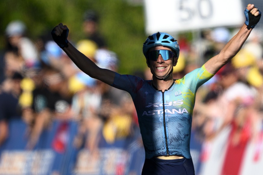 epa12067817 Lorenzo Fortunato from Italy of team XDS Astana raises his arms after crossing the finish line to win the second stage of the Tour de Romandie cycling tour over 157km from La Grande Beroch ...
