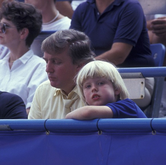 NEW YORK CITY - AUGUST 30: Donald Trump and Eric Trump attend U.S. Open Tennis Tournament on August 30, 1991 at Flushing Meadows Park in New York City. (Photo by Ron Galella/Ron Galella Collection via ...