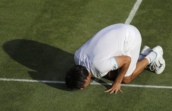 Un dernier bisou au gazon de Wimbledon, en juin 2019.