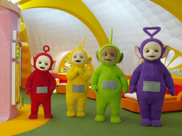 Teletubbies (L to R) Rachelle Beinart as Po, Rebecca Hyland as Laa-Laa, Nick Kellington as Dipsy, and Jeremiah Krage as Tinky Winky in Teletubbies. Cr. COURTESY OF NETFLIX © 2022