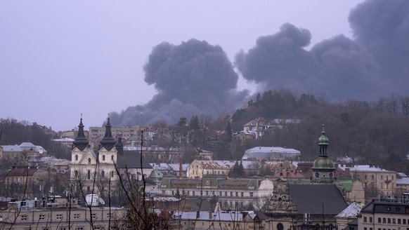 Smoke rises the air in Lviv, western Ukraine, Saturday, March 26, 2022. With Russia continuing to strike and encircle urban populations, from Chernihiv and Kharkiv in the north to Mariupol in the sout ...