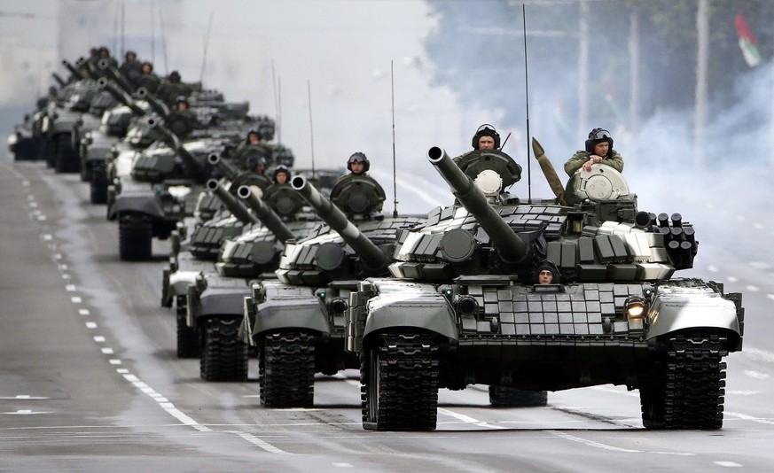 epa06054825 A column of Belarus army tanks moves along a street during an Independence Day military parade rehearsal in Minsk, Belarus, 28 June 2017. The parade will take place on 03 July to mark the  ...
