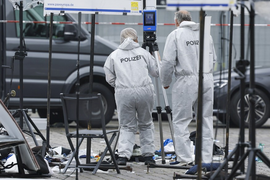 epa11381807 View of the crime scene after a knife attack in the city centre in Mannheim, Germany, 31 May 2024. According to the police, a man attacked a well-known critic of Islam in the centre of Man ...
