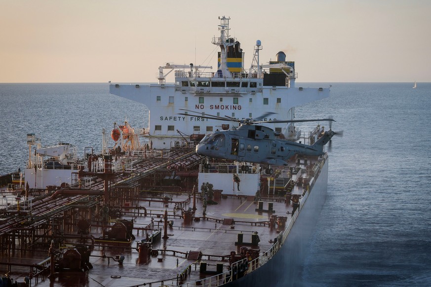 In this photo provided by the Royal Navy, Royal Marine Commandos detain sanctioned tanker, the Smyrtos, in the English Channel, Sunday, June 14, 2026. (LPhot Hutchins/Royal Navy via AP)
Britain Russia ...