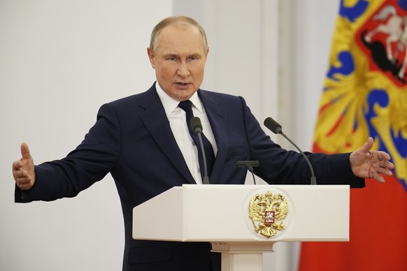 Russian President Vladimir Putin delivers his speech during an awarding ceremony for the Russian Olympic Committee medalists of the XXIV Olympic Winter Games in Beijing and members of the Russian Para ...