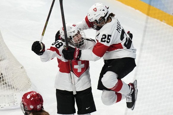 Switzerland&#039;s Phoebe Staenz (88) celebrates her goal with teammate Alina Muller (25) against the Russian Olympic Committee during a women&#039;s quarterfinal hockey game at the 2022 Winter Olympi ...