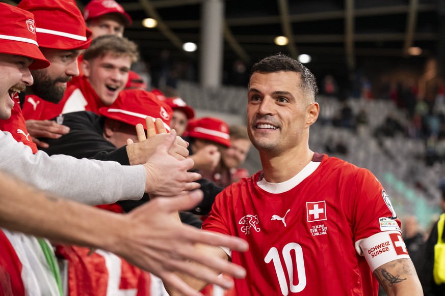 Switzerland&#039;s Granit Xhaka greets the Swiss supporters during the FIFA World Cup 26 UEFA Qualifiers Group B match between Slovenia and Switzerland, at Stozice Stadium, in Ljubljana, Slovenia, Mon ...