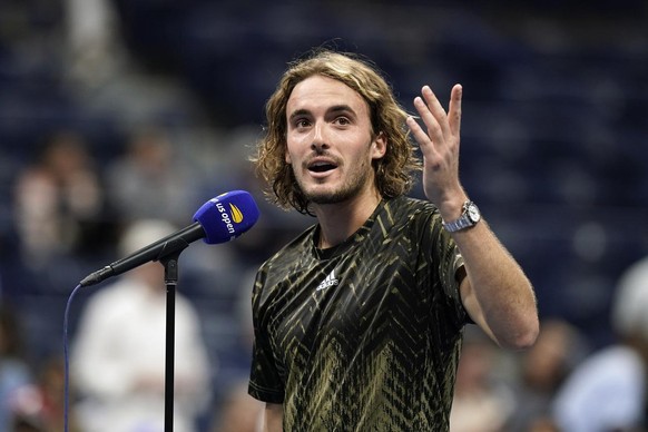 Stefanos Tsitsipas, of Greece, talks to the crowd after defeating Adrian Mannarino, of France, during the second round of the US Open tennis championships, Wednesday, Sept. 1, 2021, in New York. (AP P ...