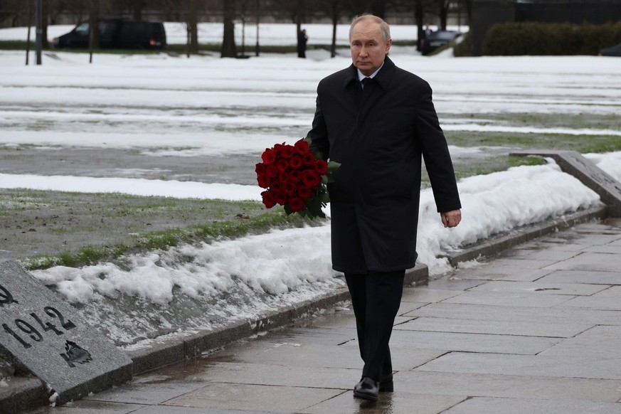 Russian President Vladimir Putin attends events marking the 80th anniversary of the break of Nazi&#039;s siege of Leningrad, (now St. Petersburg) during World War Two at the Piskaryovskoye Memorial Ce ...