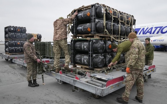 FILE - Ukrainian servicemen unpack Javelin anti-tank missiles, delivered as part of the United States of America&#039;s security assistance to Ukraine, at the Boryspil airport, outside Kyiv, Ukraine,  ...