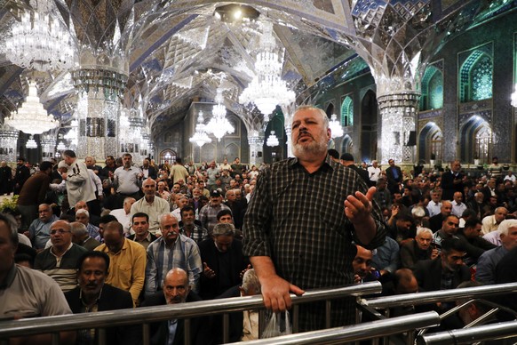 Iranian pilgrims pray for President Ebrahim Raisi at Imam Reza Shrine in the city of Mashhad, Sunday, May 19, 2024. A helicopter carrying Iranian President Raisi suffered a &quot;hard landing&quot; on ...