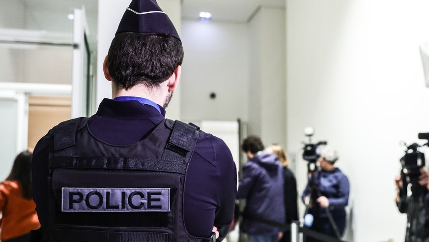 epa12572026 A police officer guards the room where the hearing at the Paris court against the Chinese brand Shein concerning the government's request to suspend the platform is held, in Paris, Fr ...